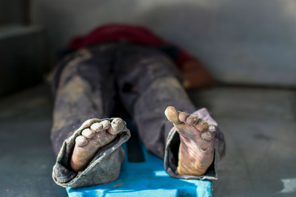  A corpse is examined in Acapulco, where drugs gangs are known for their bloodthirsty brutality