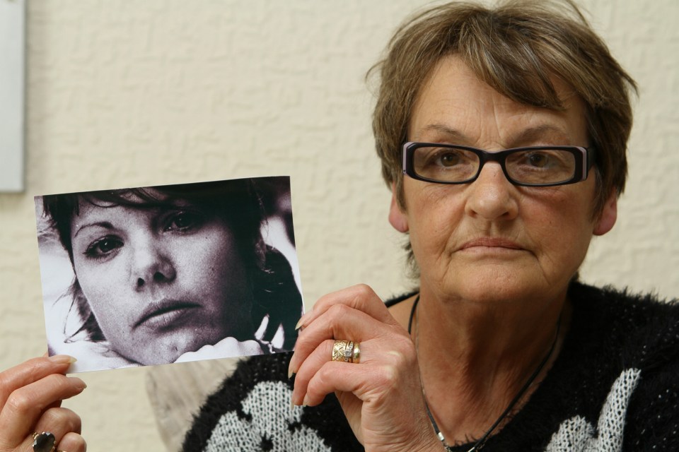  Linda Spiers holding a photo of her late daughter Charmain as a coroner recorded a open verdict on her death