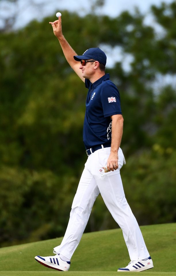  Justin Rose celebrates after hitting a hole-in-one