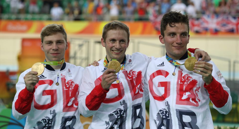 Philip Hindes, Jason Kenny and Callum Skinner hold up their Olympic gold medals in Rio