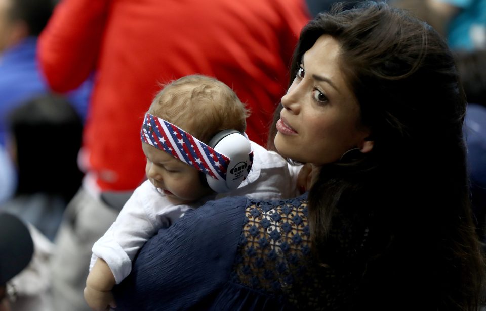 Michael Phelps' fiancee Nicole Johnson and their son Boomer in the crowd