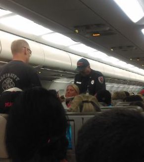  Passengers a flight attendant was taken from the plane in a neckbrace with others treated at a local hospital