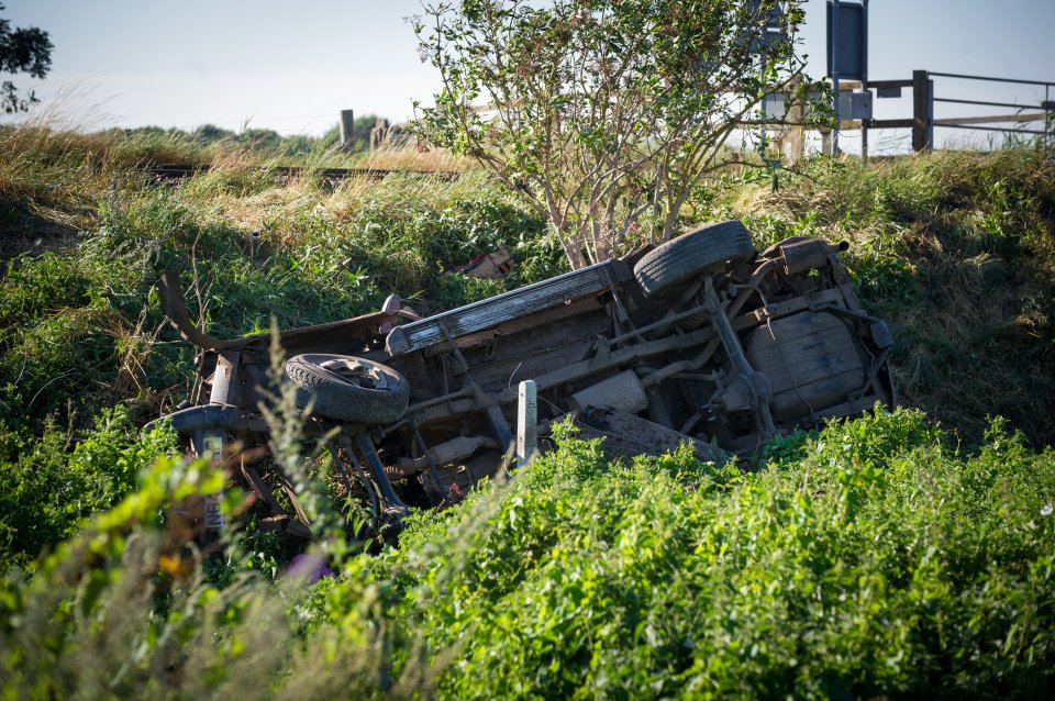  A man was left with a severe head injury after his Land Rover was struck on the train line