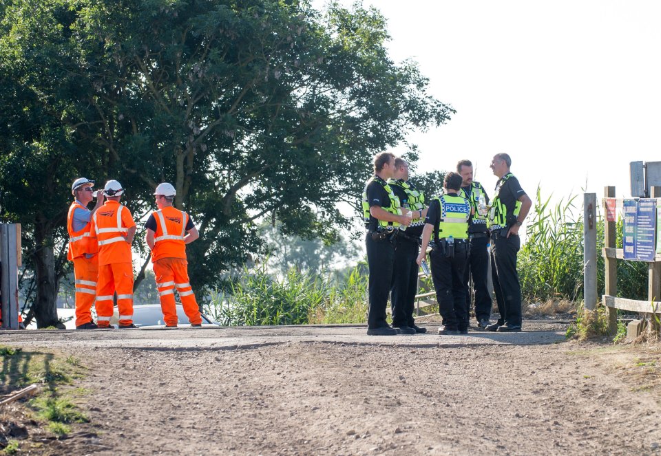  Police gather at the scene near Stretham