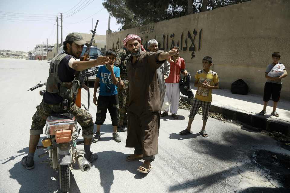  Brave SDF fighters talk with liberated civilians