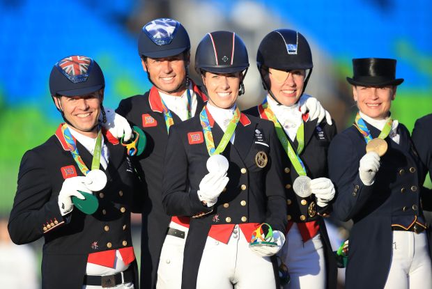 Spencer Wilton, Carl Hestor, Charlotte Dujardin and Fiona Bigwood celebrate winning silver