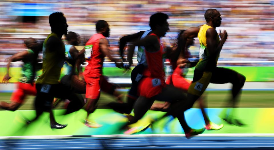 Bolt gets ahead of the field as he chases his third 100m Olympic gold medal