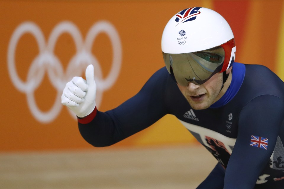 Britain's Jason Kenny reacts after comin