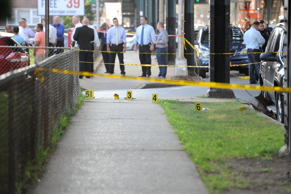 Community members gather at the spot where Imam Alala Uddin Akongi was killed in the Queens borough of New York City