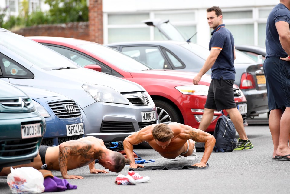 Finalists are spotted doing press-ups on the concrete