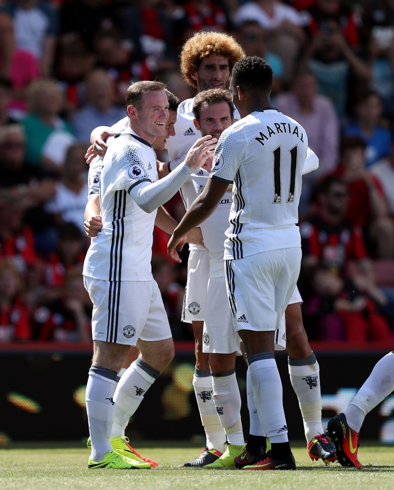  Captain  Wayne Rooney celebrates his second half goal