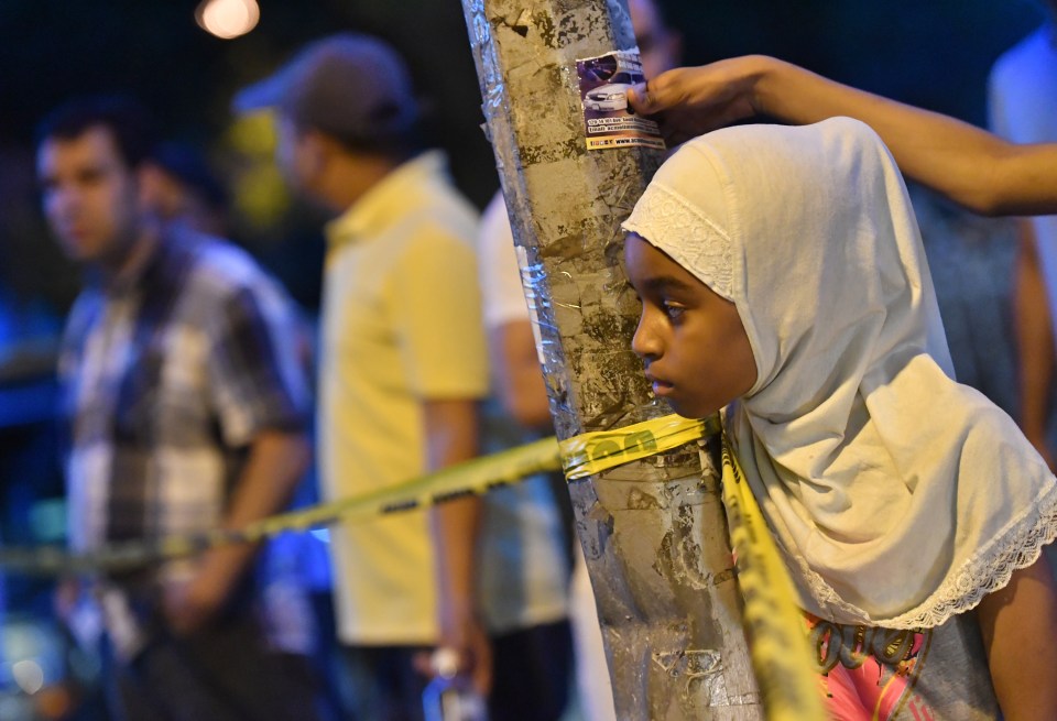 General views of the aftermath of the murder of an imam in Queens