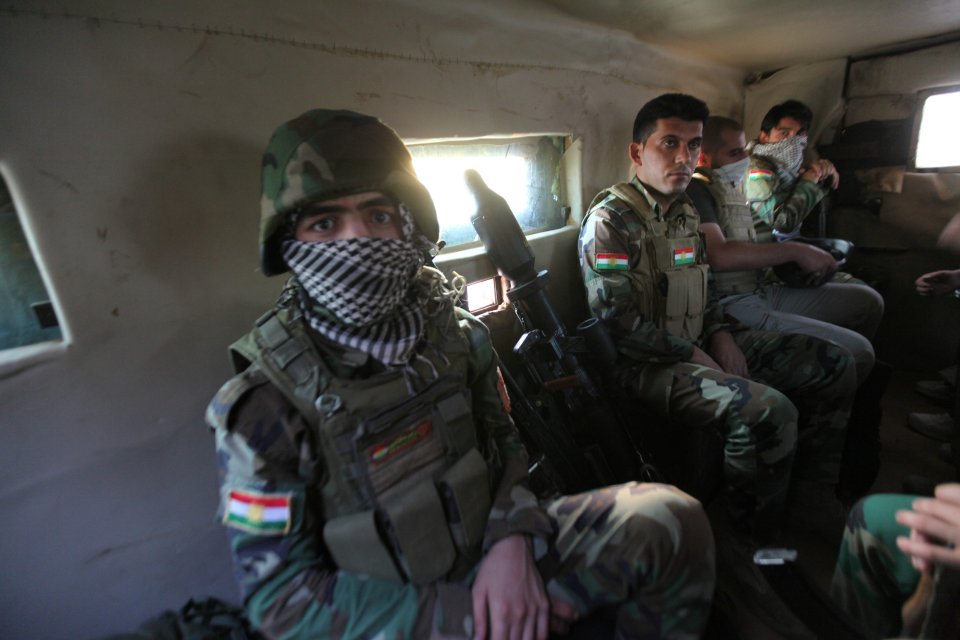  Kurdish troops heading to the front-line on the outskirts of Mosul