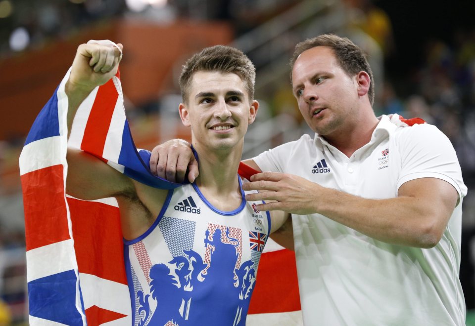  Whitlock grins as he celebrates with his personal coach Scott Hannn