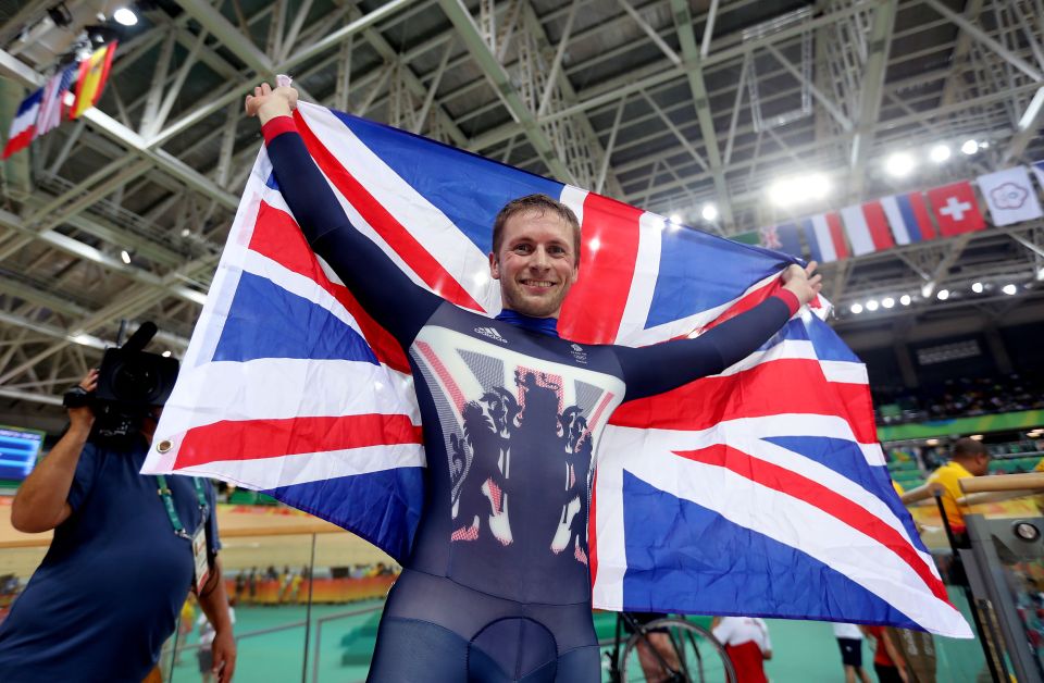 Jason Kenny proudly holds the Union Jack after winning his fifth Olympic gold