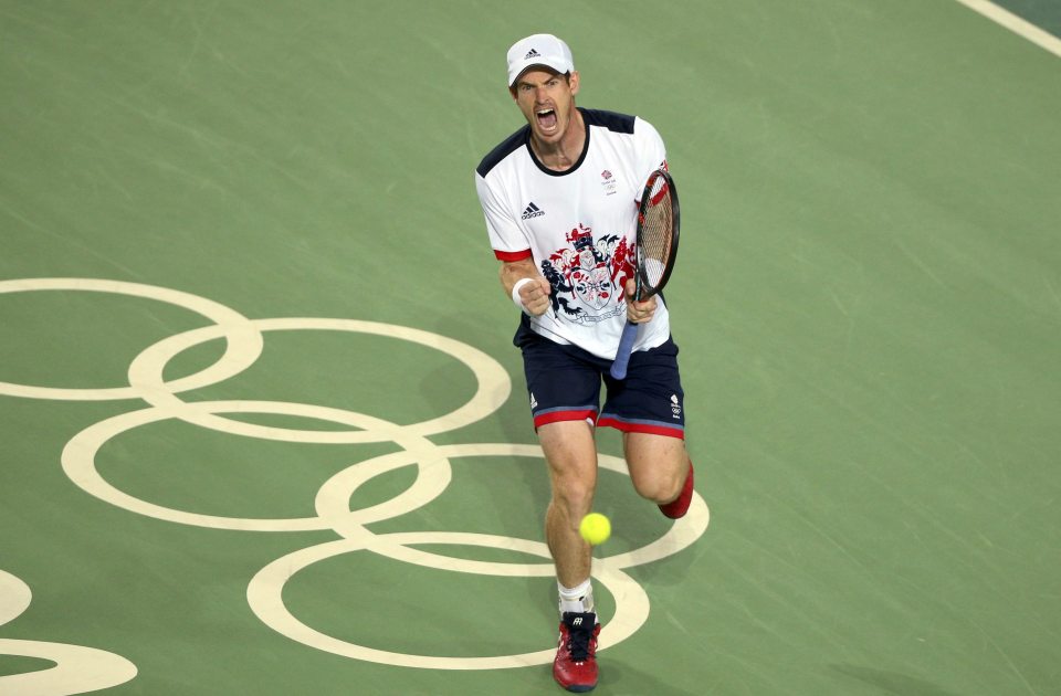 Wimbledon champ and Olympic star... Murray celebrates his gold medal win over Juan Martin del Potro