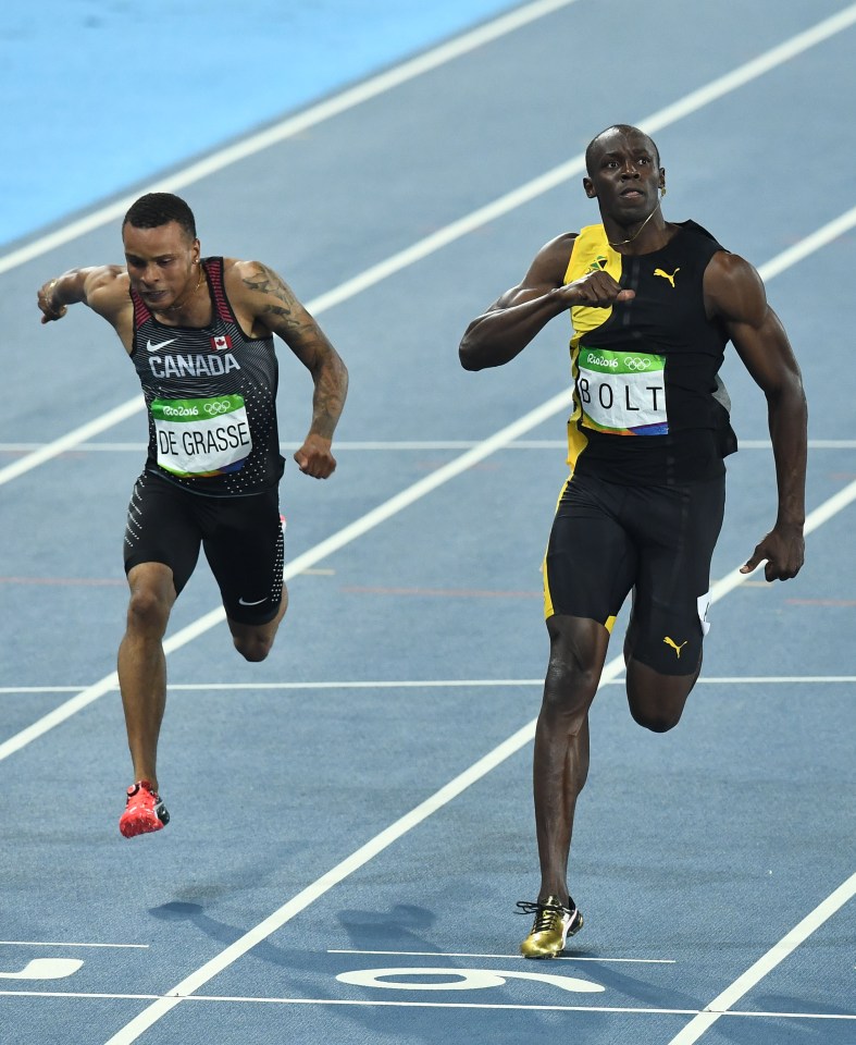  Usain Bolt celebrates crossing the line in first - again