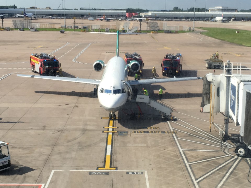  The Manchester City plane is surrounded by fire engines