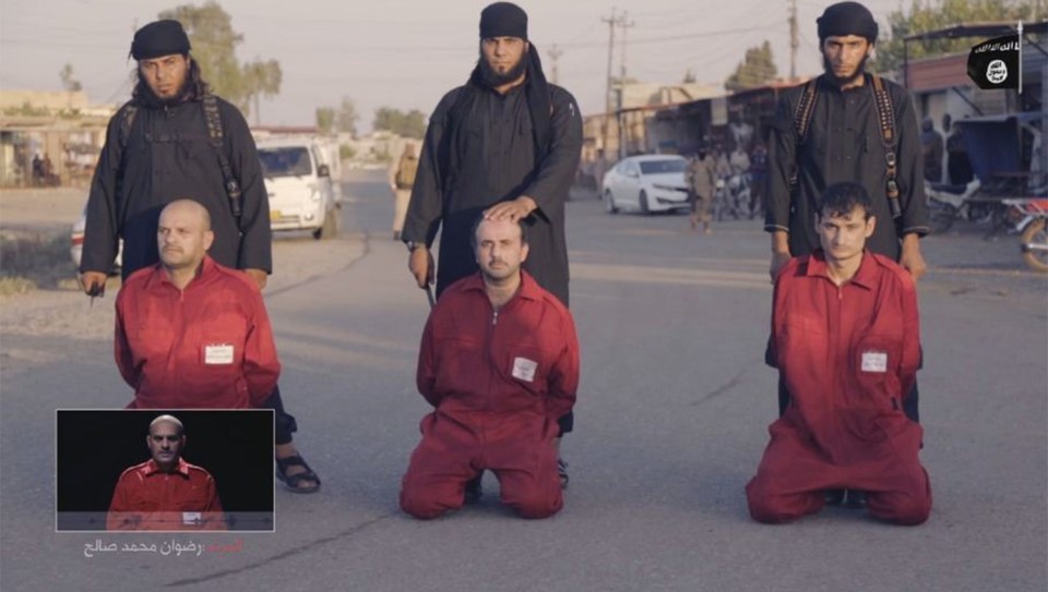  ISIS thugs prepare to behead three men they accuse of being spies