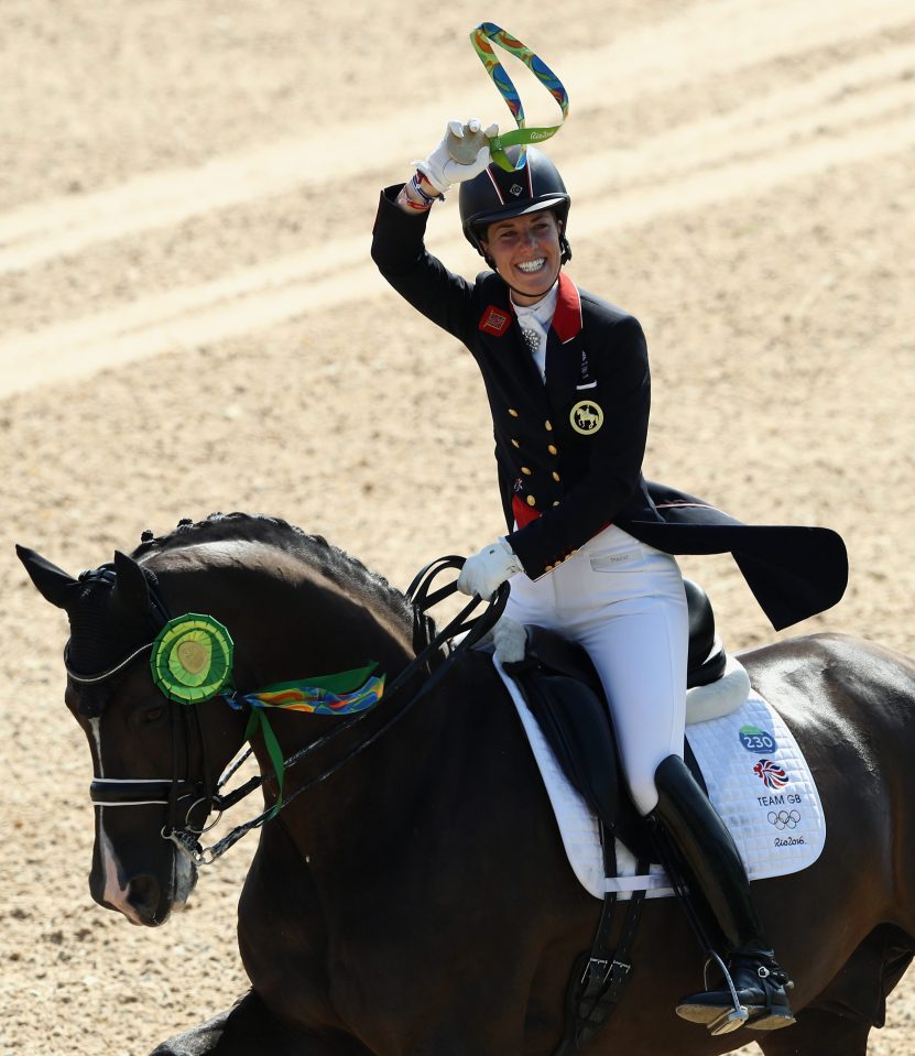 Dujardin celebrates victory in the dressage that took GB to 16 golds