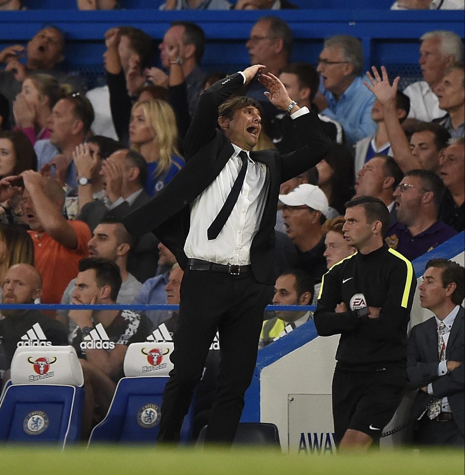 Antonio Conte's tie flaps about as he charges around the technical area