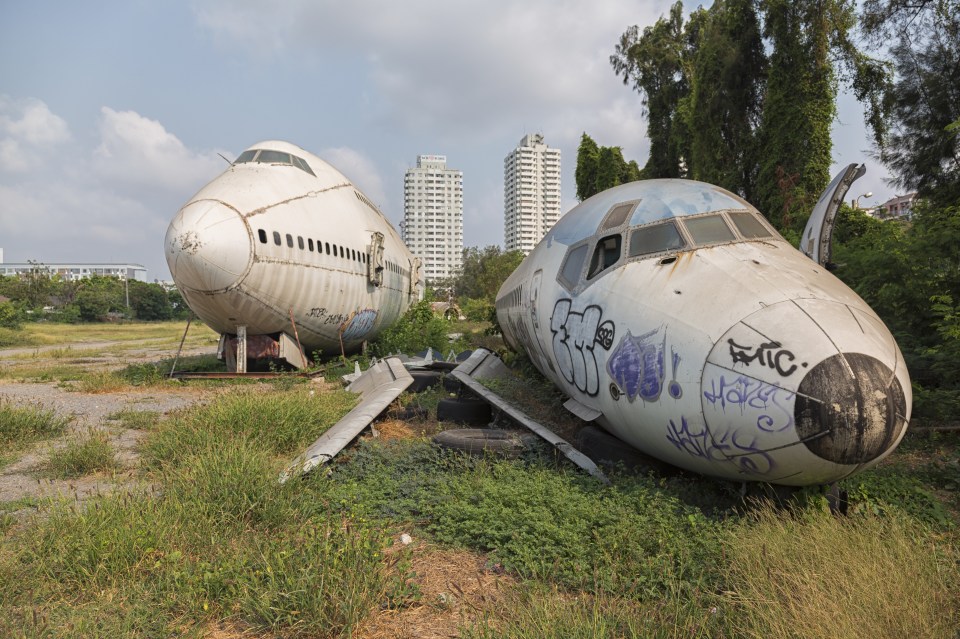 Sections of the plane are strewn across the unconventional tourist attraction in Bangkok