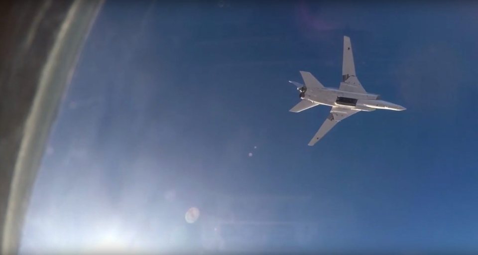  An image from Russian Defense Ministry video footage that was issued 16 August 2016, showing a Tu-22M3 long-range bomber in flight after releasing its payload above Syria