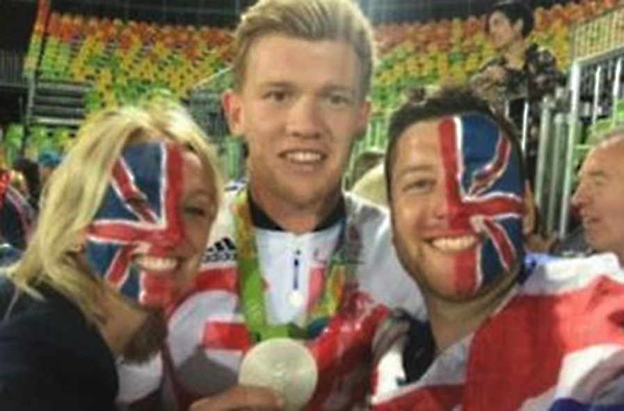  Newlyweds Kirsty and Matt Hardman pictured with rugby sevens player Sam Cross may just be the Team GB super fans of 2016