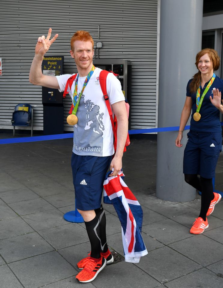 Ed Clancy arrives back in Manchester with his gold medal