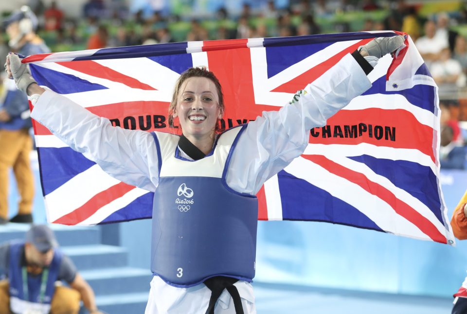 Jones holds the British flag aloft after her win