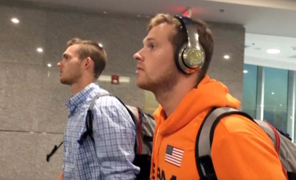 U.S. Swimmers Jack Conger and Gunnar Bentz arrive on an overnight flight from Brazil to Miami in Miami