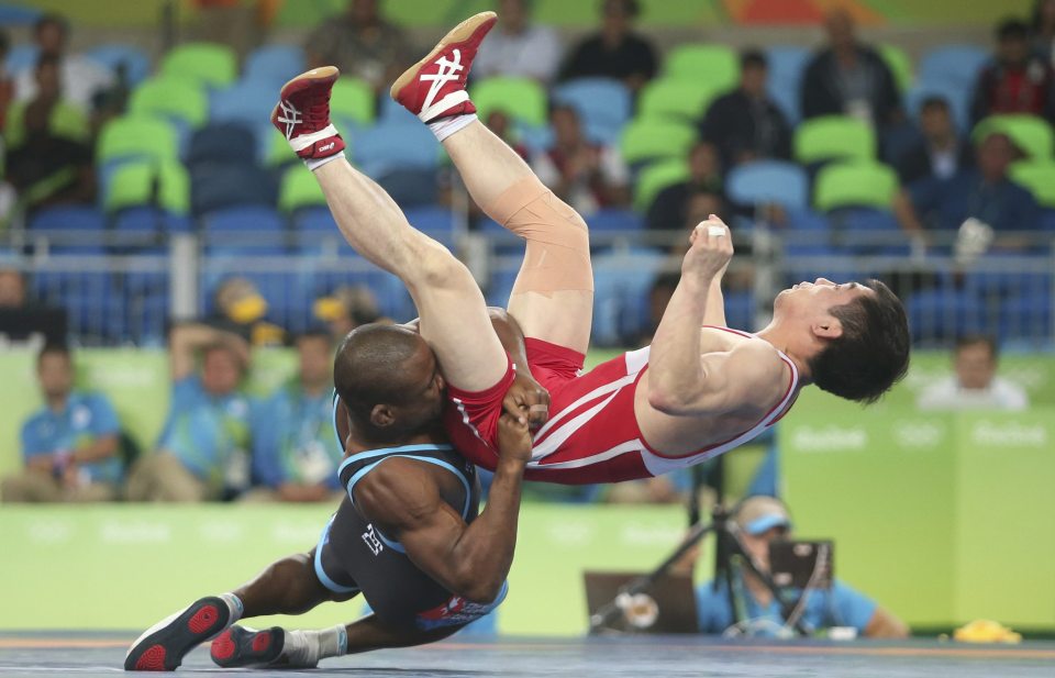  North Korea were given a trouncing in Rio with wrestler Yang Kyong Il (right) among those given a pasting