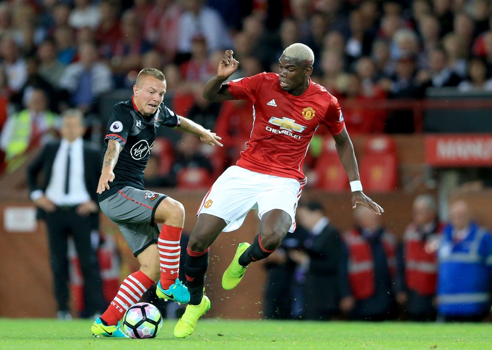 Paul Pogba tussles with Southamptons Jordy Clasie as he impresses at Old Trafford