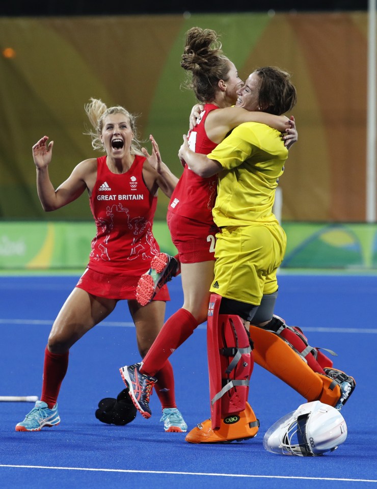 Hinch is congratulated by her team-mates after helping them win a first hockey gold 