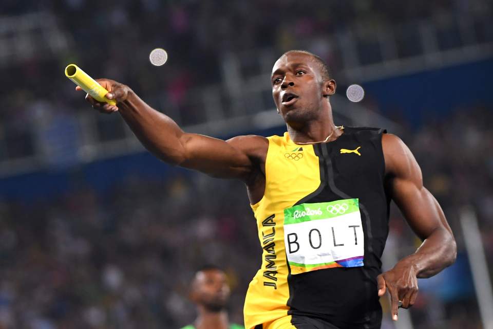 Usain Bolt celebrates after crossing the line to bow out with a perfect Olympic record