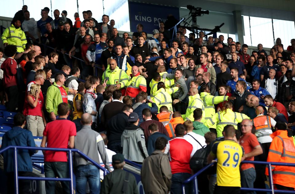 Fans are separated after a confrontation at the final whistle