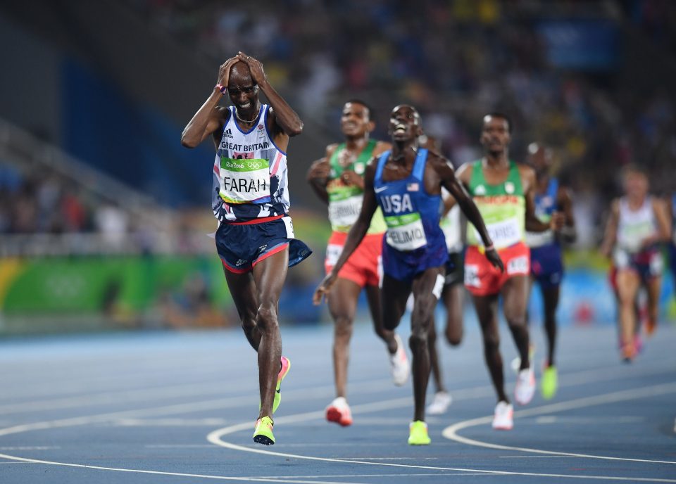  Mo Farah holds his head in his hands in disbelief after taking 5,000 metres gold