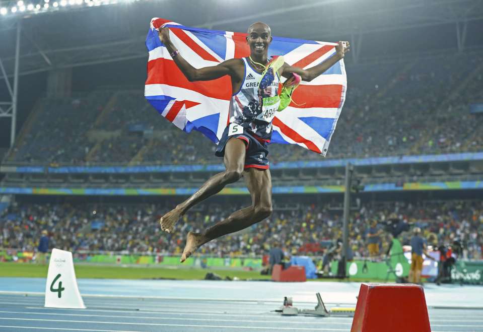  Mo Farah jumps in the air with the Union Jack after winning 5,000 metres gold