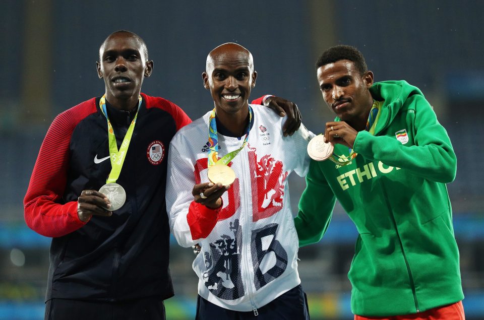 Paul Chelimo (left) eventually DID pick up a silver medal in the 5,000 metres after Team USA lodged a successful protest over his disqualification