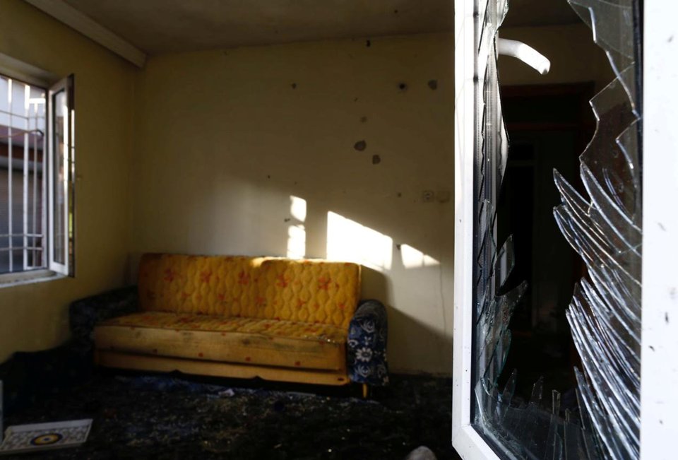  A home is damaged in the bombing, with the town still working to come to grips with the attack