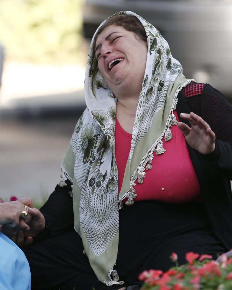  A relative of one of the victims killed weeps after the horrific attack