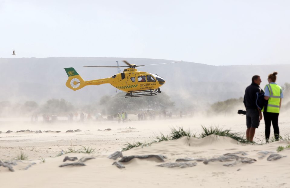  A man died after getting into difficulty swimming in "very rough seas" at Sandbanks