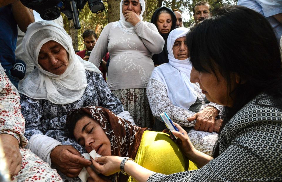  A woman cries during one of the funerals of the suicide bombing victims