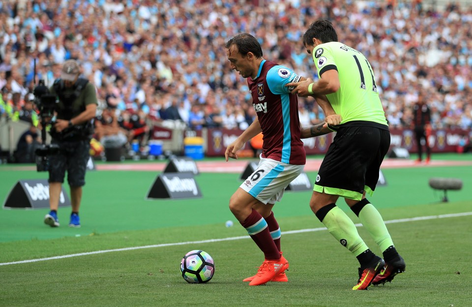 West Ham's Mark Noble battles for the ball with Bournemouth's Charlie Daniels