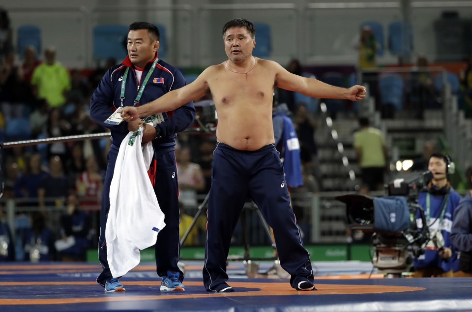 When the result was read out, his stunned coaches entered the mat