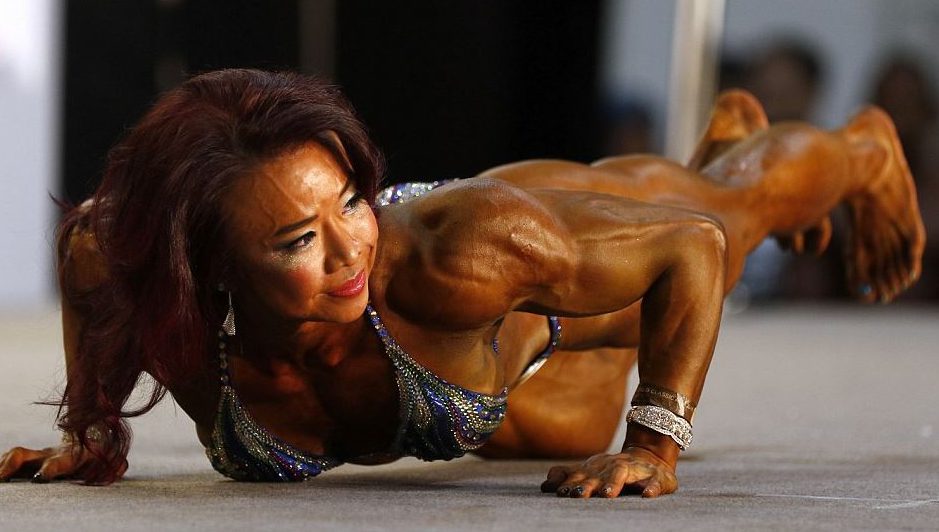  A competitor does push-ups in front of the judges