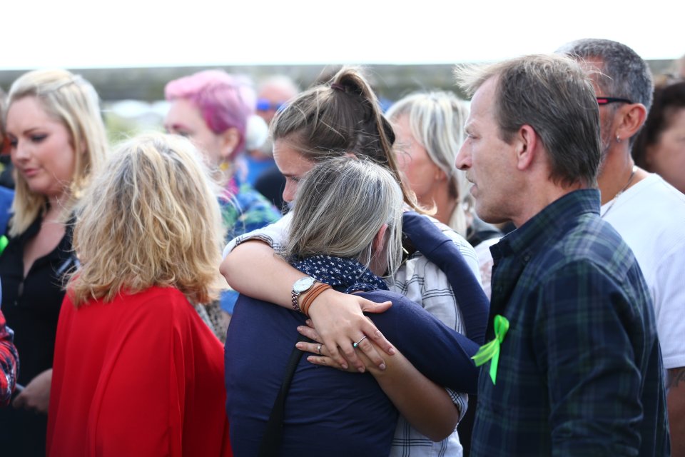  Names of the 11 who died when the 1950s plane came down in front of thousands were read aloud