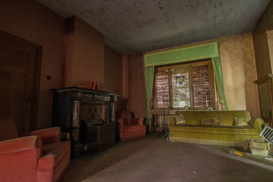 A second living room also features a fireplace - and soft single person sofas