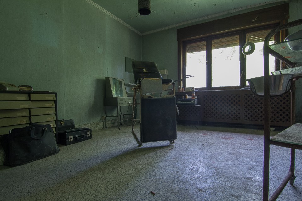 The ripped and torn dentist's chair sits in the same spot where patients once lay on it