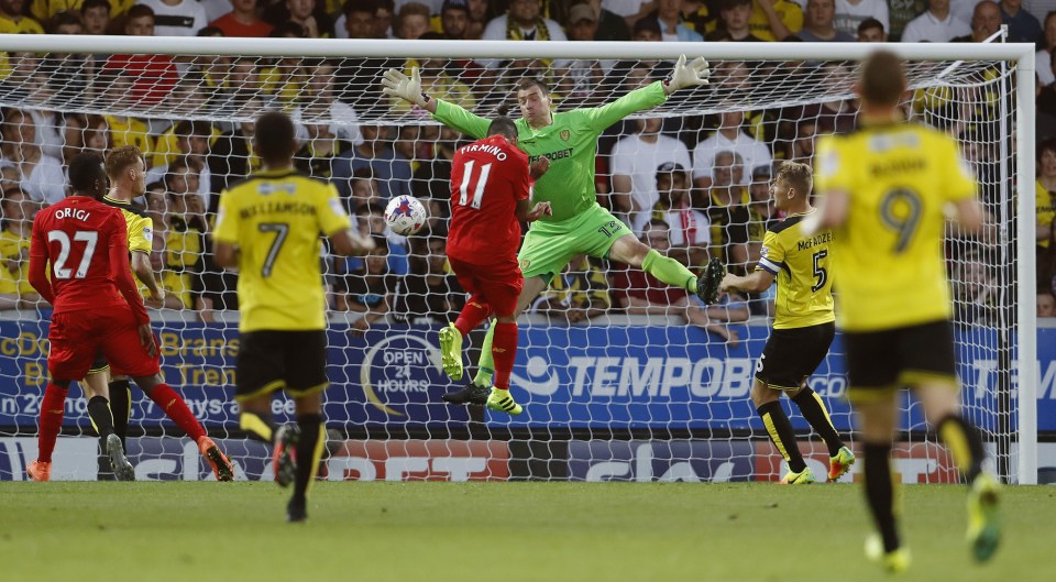 Roberto Firmino heads home a second goal for Liverpool